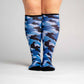 A person wearing blue camo compression socks, 
